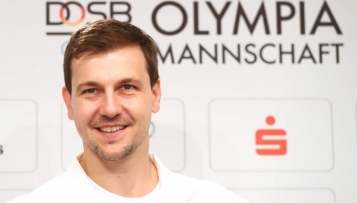 Timo Boll trägt die deutsche Fahne